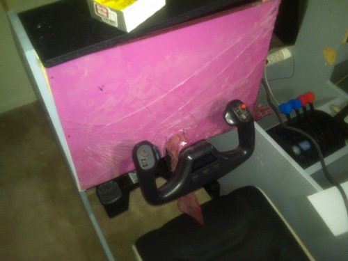 The left side instrument panel is being measured for its fascia overlay.  A plate of plexiglass is cut, drilled, and painted to not only protect the monitor, but to give the panel a cohesive look.  Plexiglass is not cheap though.