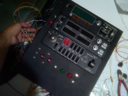 The center console is painted, assembled, and ready to be installed.  I still need to label the switches, neaten up the wiring in the back, and reconfigure the UHID device for the new switch settings.  This panel bolts down onto the edge of the plexiglass fascias for the left and right monitors.  Just sits on top of them using the same mounting brackets.