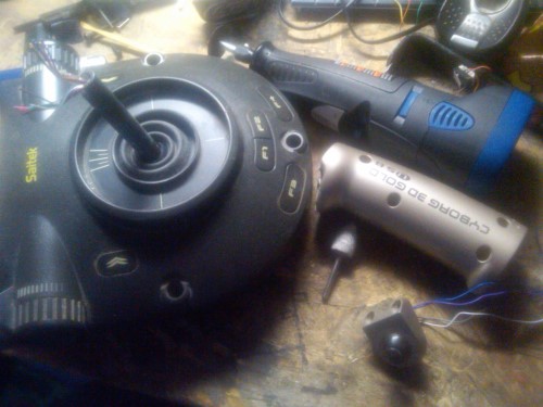 This is another side-project I am working on.  I am taking an old Saitek Cyborg usb stick and chopping it, extenting the length of the arm, and turning it into a collective for the right seat.  Currently I just flip the jet throttle sideways, but that's not really the same as a collective.  I just hope that when I plug it in, Xplane can handle the new axis.  I already have 2 full sets of controllers on this system, will it work with yet another???